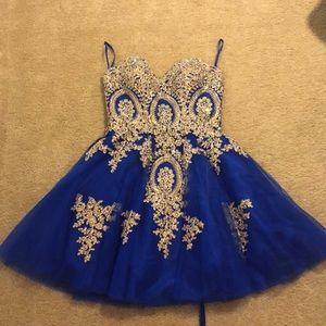 Royal blue prom dress with gold detailing.